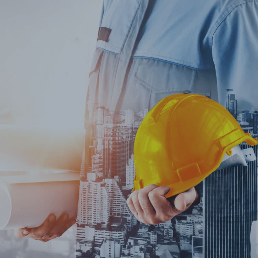 Acumatica Cloud ERP Construction workers building a structure, showcasing cranes and scaffolding in an urban environment.